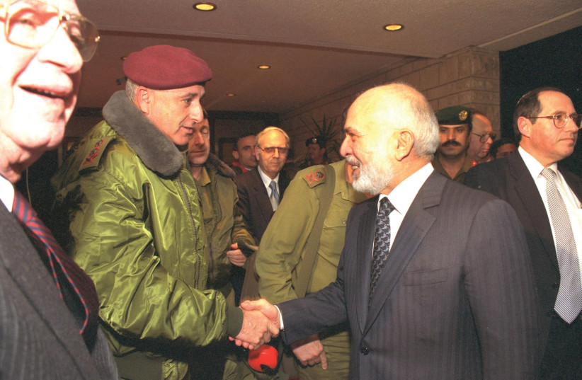 HALEVY (CENTER back) looks on as Jordan’s King Hussein shakes hands with IDF chief of staff Amnon Lipkin Shahak at the royal palace in Amman on January 12, 1995 (credit: MAARIV)