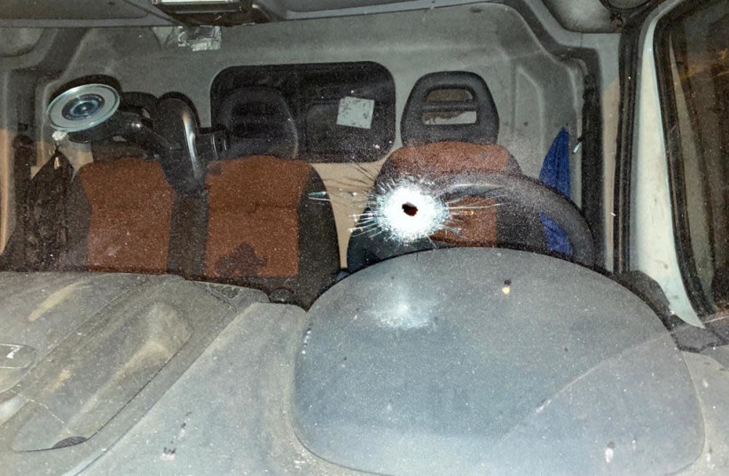 The gunshot window of a car in Ramle, where a brawl between two rival families led to the arrest of 69 individuals, April 16, 2021.  (photo credit: ISRAEL POLICE)