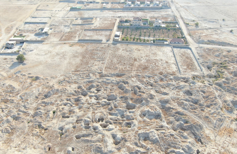 Photo of the remains of the Herodian era town of Archelais, with craters to show where thieves have dug into the Jordan Valley site. (photo credit: PRESERVING THE ETERNAL)