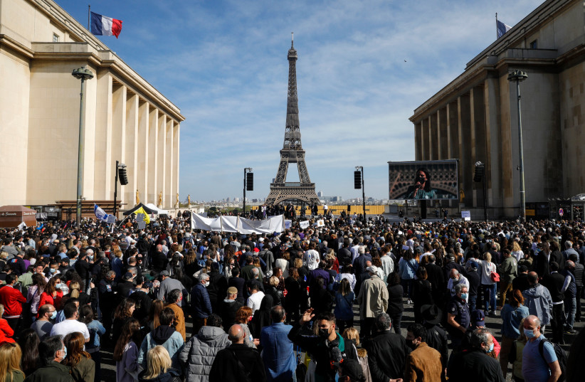 People gather to ask for justice for late Sarah Halimi on Trocadero plaza in front of the Eiffel Tower in Paris yesterday. (photo credit: GEOFFROY VAN DER HASSELT/AFP VIA GETTY IMAGES)