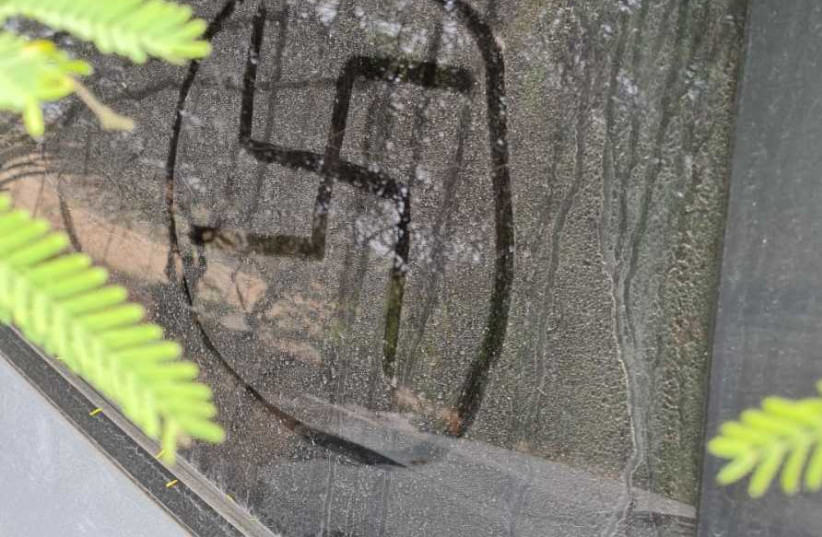 Swastika painted on car in Kibbutz Hatzerim in the Negev. (photo credit: Courtesy)