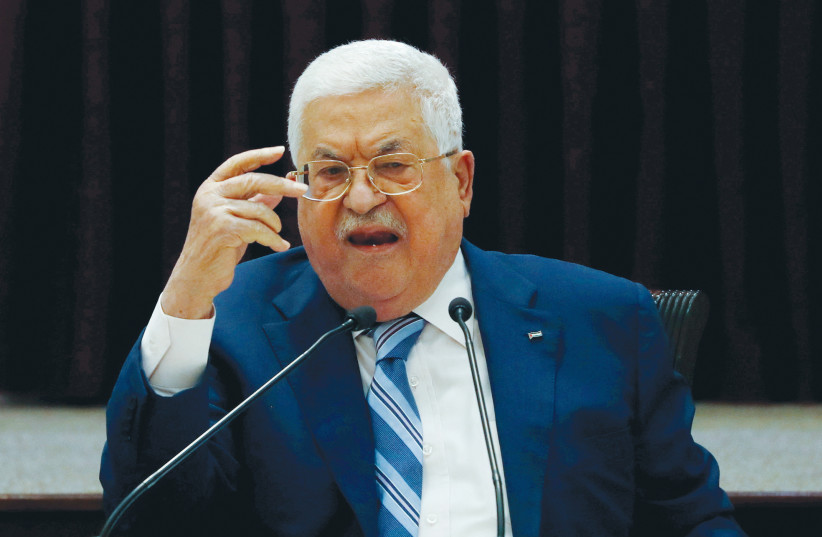 PA PRESIDENT Mahmoud Abbas gestures during a meeting in Ramallah last August. (credit: MOHAMAD TOROKMAN/REUTERS)
