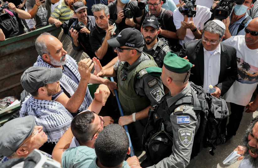 Security forces clash with protesters during a protest against a visit of right wing politicians and against Israel’s plan to demolish some houses of Palestinians in the east Jerusalem neighborhood of Sheikh Jarrah on May 10, 2021 (photo credit: OLIVIER FITOUSSI/FLASH90)