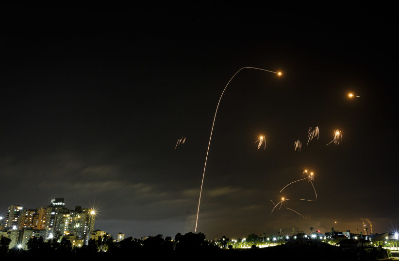A long exposure picture shows iron dome anti-missile system fires interception missiles as rockets fired from the Gaza Strip to Israel, as it seen from the southern Israeli city of Ashkelon, May 10, 2021. (credit: EDI ISRAEL/FLASH90)