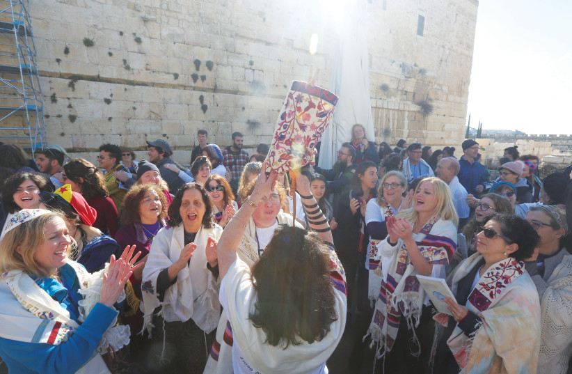 DANCING WITH a Torah at the Kotel (credit: MARC ISRAEL SELLEM)