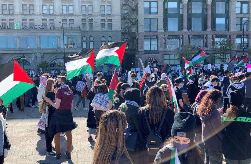 Demonstrators holding flags and banners attend a pro-Palestinian protest in Chicago, Illinois, US, May 12, 2021, in this screen grab obtained from a social media video. Picture taken May 12, 2021. (credit: JBING VIA REUTERS)