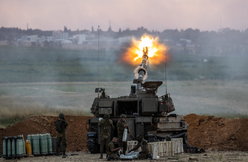 IDF (Israel Defense Force) Artillery Corps seen firing into Gaza, near the Israeli border with Gaza on May 17, 2021.  (photo credit: YONATAN SINDEL/FLASH 90)
