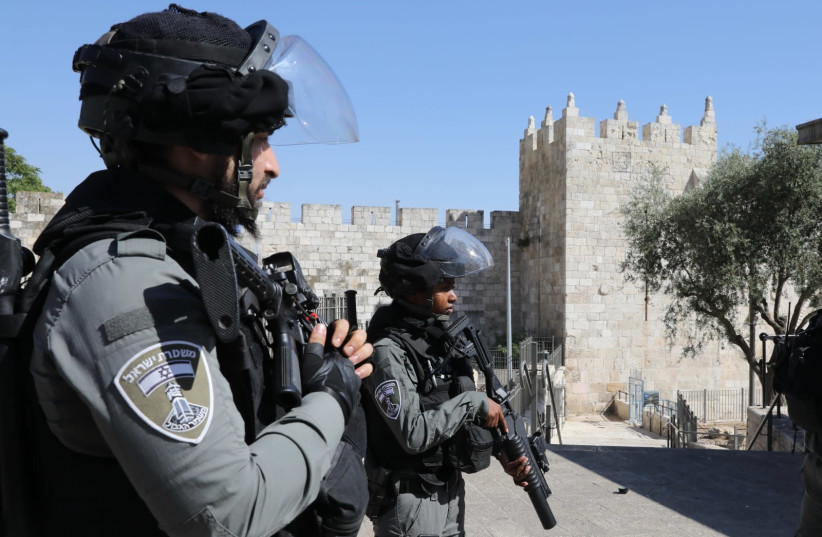 Israel Border Police officers stand guard at the Damascus Gate (credit: MARC ISRAEL SELLEM)