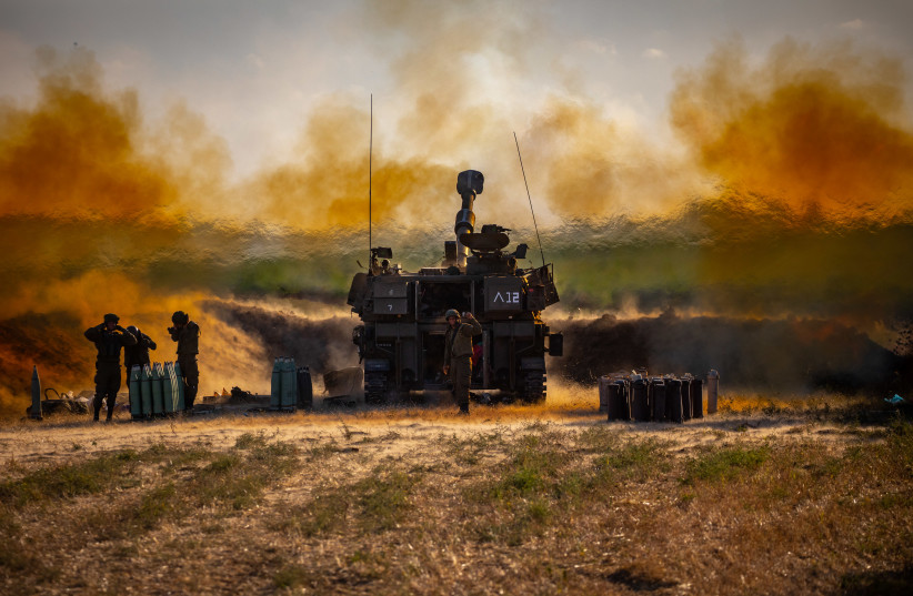IDF (Israel Defense Force) Artillery Corps seen firing into Gaza, near the Israeli border with Gaza on May 19, 2021. (photo credit: OLIVIER FITOUSSI/FLASH90)