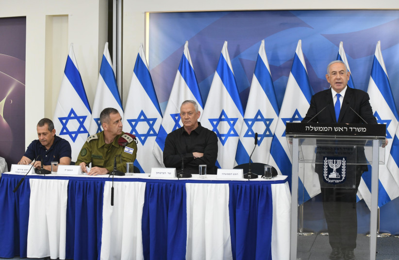 Prime Minister Benjamin Netanyahu address a press conference alongside Defense Minister Benny Gantz and IDF Chief of Staff Lt.-Gen. Aviv Kohavi on Operation Guardian of the Walls, May 21, 2021 (photo credit: AMOS BEN-GERSHOM/GPO)