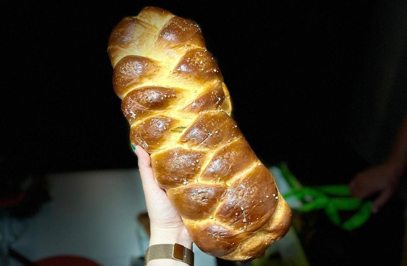 A fresh challah comes out of the oven (Illustrative) (credit: Courtesy)