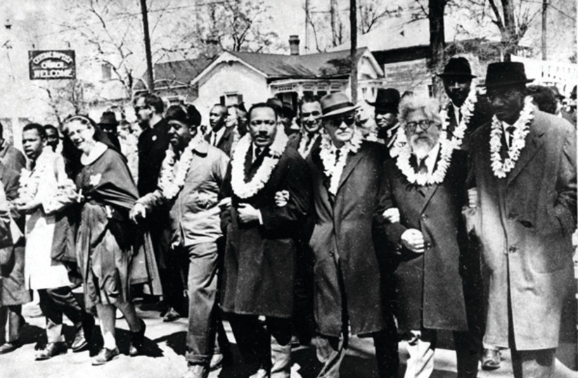 Rabbi Abraham Joshua Heschel (second from right) marching with Martin Luther King Jr. from Selma to Montgomery in 1965 (credit: WIKIPEDIA)