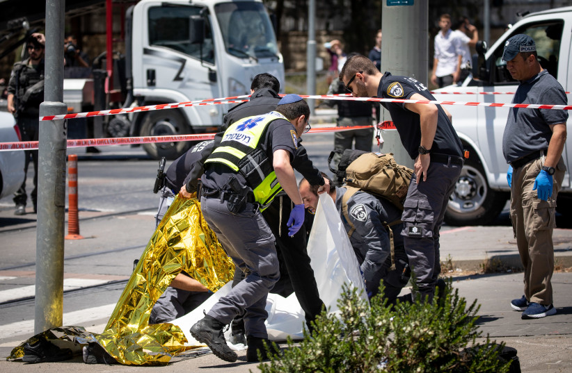 Israeli police at the scene of a stabbing attack near Ammunition Hill, in Jerusalem. Two young men were injured in the terrorist attack, the terrorist was shot. May 24, 2021.  (photo credit: YONATAN SINDEL/FLASH 90)