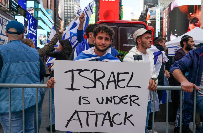 People participate in a Pro-Israel rally at Times Square in New York City, US, May 12, 2021. (photo credit: REUTERS/DAVID 'DEE' DELGADO)