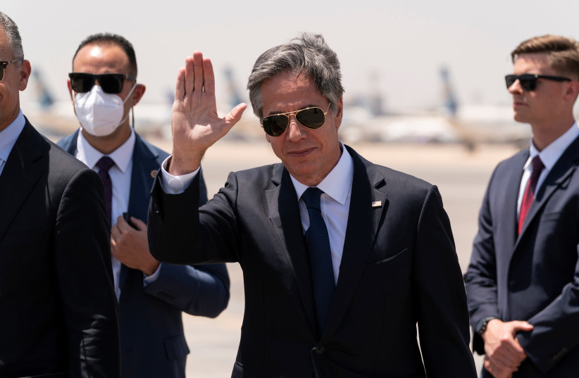 US Secretary of State Antony Blinken waves as he steps off his plane upon arrival at Cairo International Airport, in Cairo, Egypt May 26, 2021. (photo credit: ALEX BRANDON/POOL VIA REUTERS)