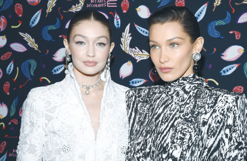 GIGI HADID and Bella Hadid attend the Harper’s Bazaar Exhibition last year in Paris. (credit: PASCAL LE SEGRETAIN/GETTY IMAGES/TNS)