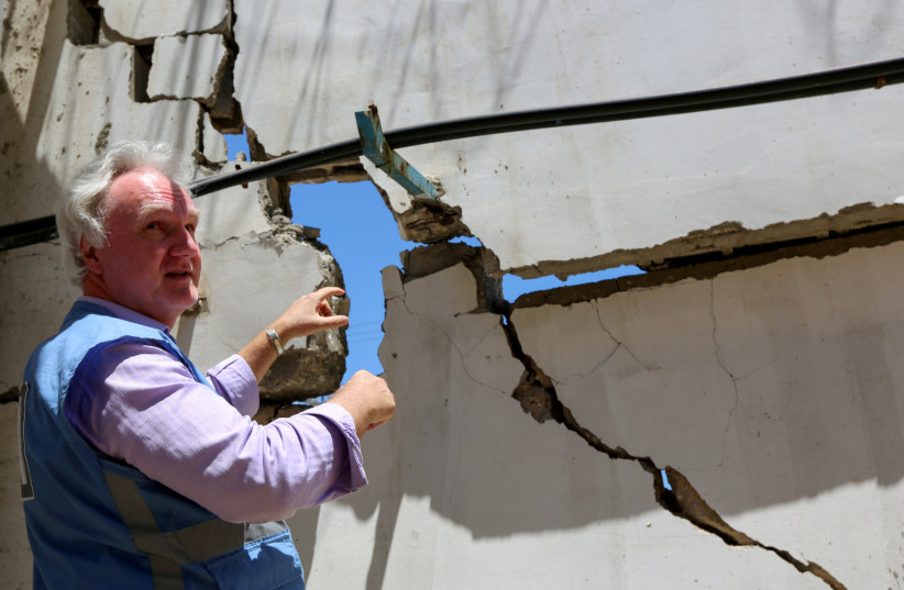 Matthias Schmale, UNRWA's Gaza director, gestures as he inspects the damage at UNRWA'S headquarters, in the aftermath of Israeli air strikes, in Gaza City May 18, 2021. (photo credit: REUTERS/MOHAMMED SHANA)