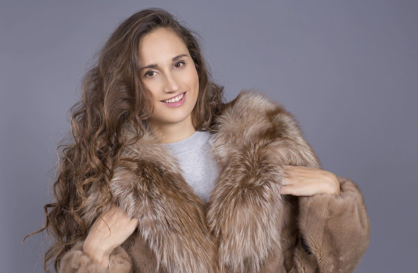 A woman is seen wearing a fur coat. (photo credit: PIXABAY)