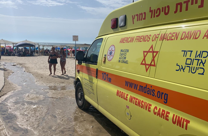 AN MDA AMBULANCE at Dor Beach after a man drowned at the beach on Saturday afternoon, June 12 2021 (photo credit: MDA SPOKESPERSON)