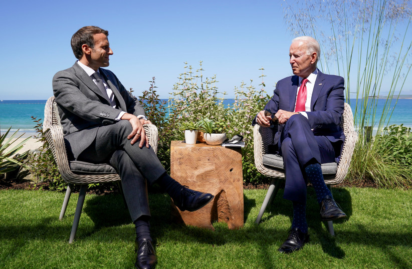 US President Joe Biden and France's President Emmanuel Macron attend a bilateral meeting during the G7 summit in Carbis Bay, Cornwall, Britain, June 12, 2021. (credit: KEVIN LAMARQUE/REUTERS)