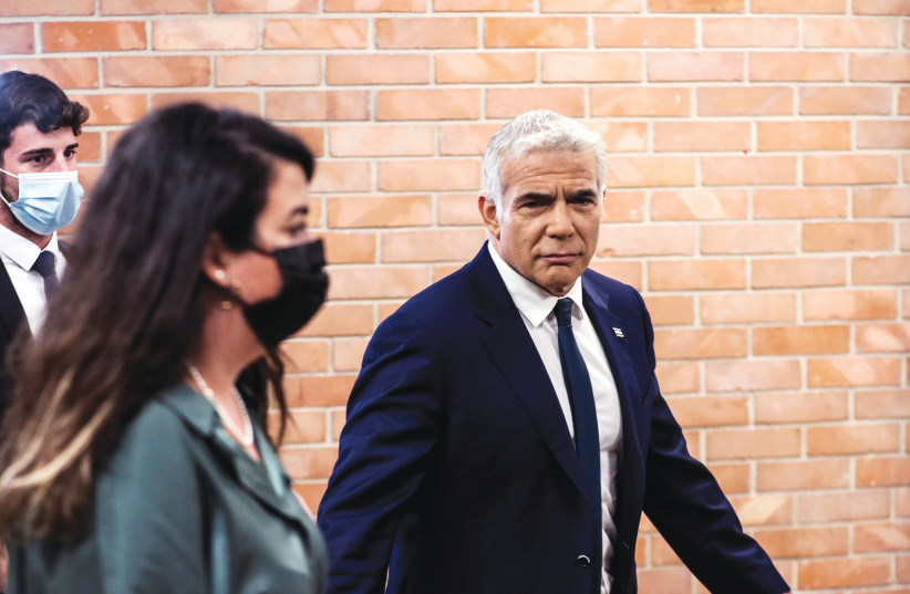 YAIR LAPID, foreign minister-designate, at the Knesset yesterday. (photo credit: MARC ISRAEL SELLEM)