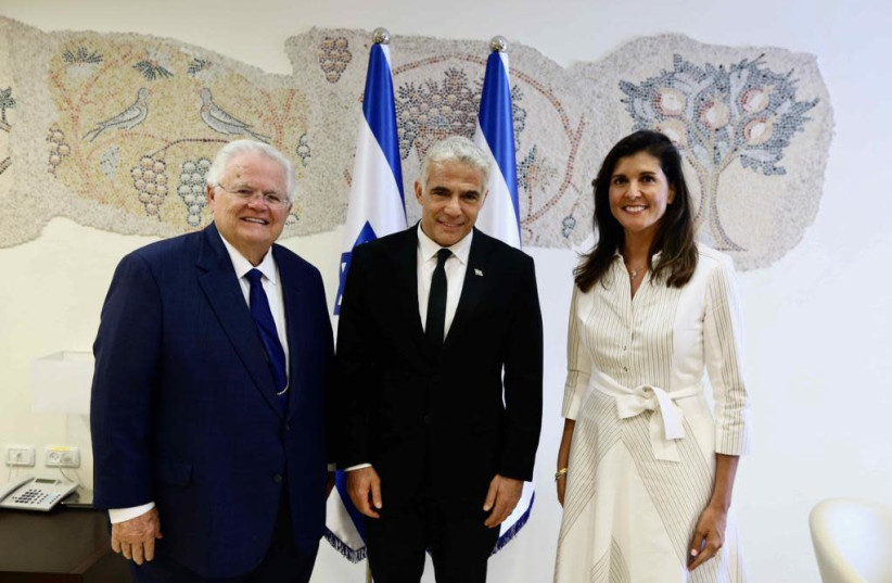 Pastor John Hagee pictured next to Foreign Minister Yair Lapid and former US Ambassador to the UN Nikki Haley. (credit: OREN COHEN VIA CUFI)