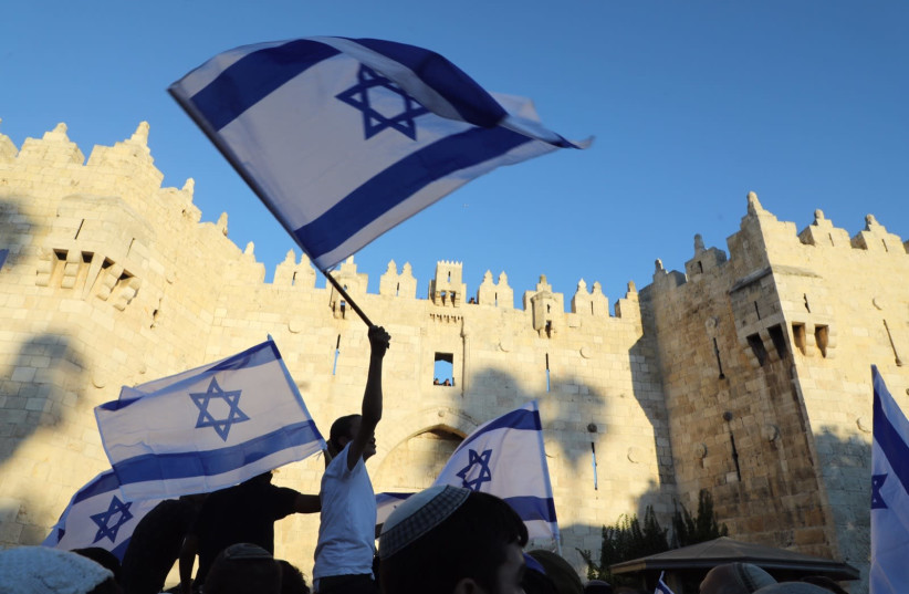 Palestinians clashed with Israeli forces in Jerusalem, as Jewish groups conducted a flag march through the Old City (credit: MARC ISRAEL SELLEM)