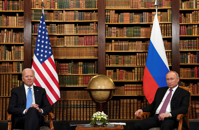 US President Joe Biden and Russia's President Vladimir Putin meet for the U.S.-Russia summit at Villa La Grange in Geneva, Switzerland, June 16, 2021 (photo credit: REUTERS/KEVIN LAMARQUE)