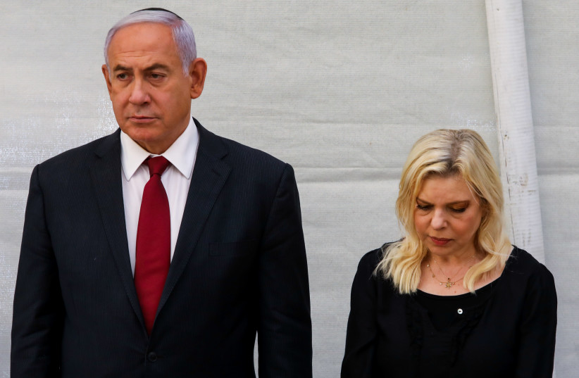 Former prime minister Benjamin Netanyahu with his wife Sara at a memorial service for his brother Yoni Netanyahu at Mount Herzl, June 16 2021. (credit: MARC ISRAEL SELLEM/THE JERUSALEM POST)