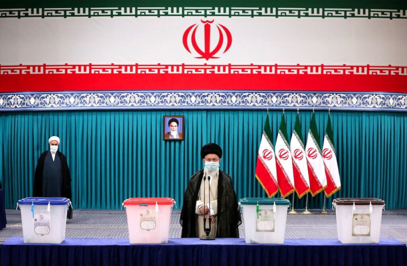Iran's Supreme Leader Ayatollah Ali Khamenei is seen to vote during Iranian presidential election in Tehran (credit: REUTERS)