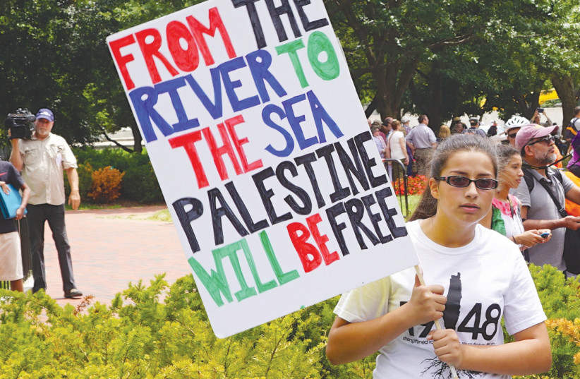 A WOMAN PROTESTS at a pro-Palestinian rally. The recent Israel-Hamas war seemingly confirmed what many have long suspected about the BBC’s coverage. (credit: TED EYTAN/FLICKR)