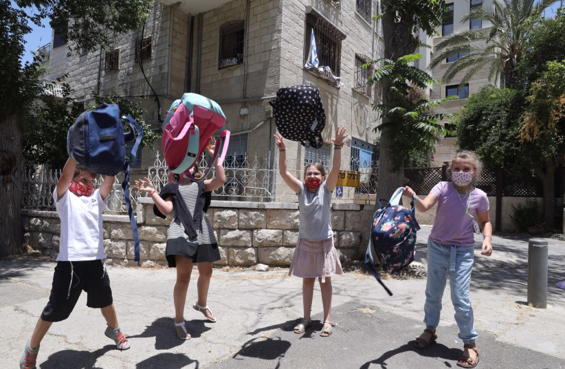 Children are seen celebrating the last day of school in Jerusalem, on June 30, 2021. (credit: MARC ISRAEL SELLEM/THE JERUSALEM POST)