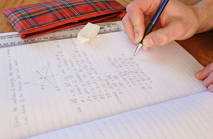 Person doing math homework (credit: Wikimedia Commons)