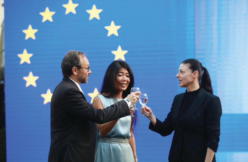 EUROPEAN UNION delegation head Emanuele Giaufret and his wife, Min-Ja Masson, make a toast with MK Merav Michaeli.  (photo credit: TAL SHAHAR)
