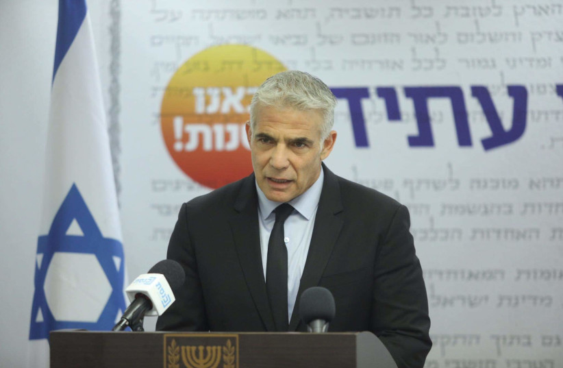 Foreign Minister Yair Lapid is seen speaking at the Knesset, on July 5, 2021. (photo credit: MARC ISRAEL SELLEM/THE JERUSALEM POST)