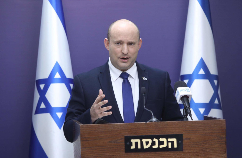 Prime Minister Naftali Bennett is seen speaking at the Knesset, on July 5, 2021. (photo credit: MARC ISRAEL SELLEM/THE JERUSALEM POST)