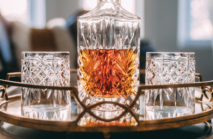 Illustrative photo of whiskey in two glasses.  (credit: VICTOR HUGHES/UNSPLASH)