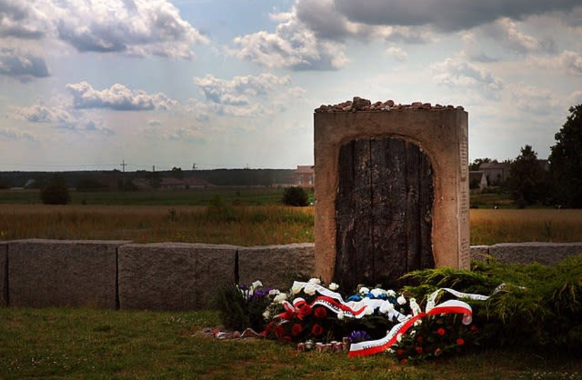 Memorial in Jedwabne, dedicated to murdered Jews: "In remembrance of the Jews from Jedwabne and surrounding areas, men, women, children, co-habitants of this earth, murdered, burned alive here on July 10th, 1941" (photo credit: Wikimedia Commons)