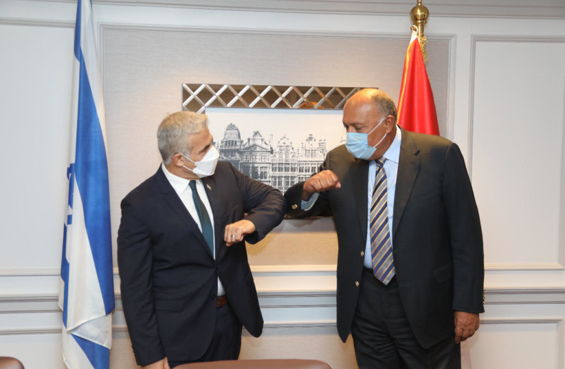 Yair Lapid and the Egyptian foreign minister meeting for the first time. (Photo credit: Gabi Farkash)