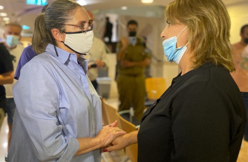 Michal Herzog, the wife of Israel's President Isaac Herzog, visited a disabled veteran who set himself on fire at a Defense Ministry office in April. (credit: OFFICE OF THE PRESIDENT)