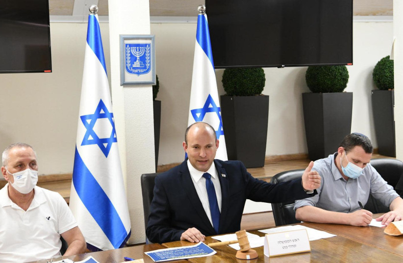 Prime Minister Naftali Bennett addresses the coronavirus cabinet on Friday, July 16, as number of new cases rise (photo credit: ROEE AVRAHAM/GPO)