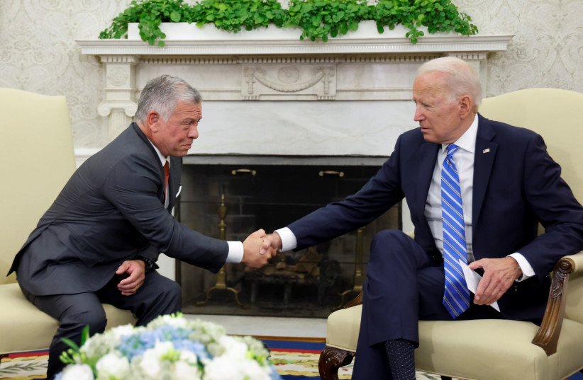 US President Joe Biden shakes hands with Jordan's King Abdullah II in the Oval Office at the White House in Washington, US, July 19, 2021. (photo credit: REUTERS/JONATHAN ERNST)