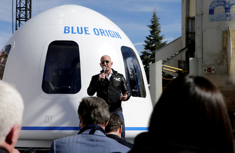 Amazon and Blue Origin founder Jeff Bezos addresses the media about the New Shepard rocket booster and Crew Capsule mockup at the 33rd Space Symposium in Colorado Springs, Colorado, United States April 5, 2017. (credit: REUTERS/ISAIAH J. DOWNING/FILE PHOTO)