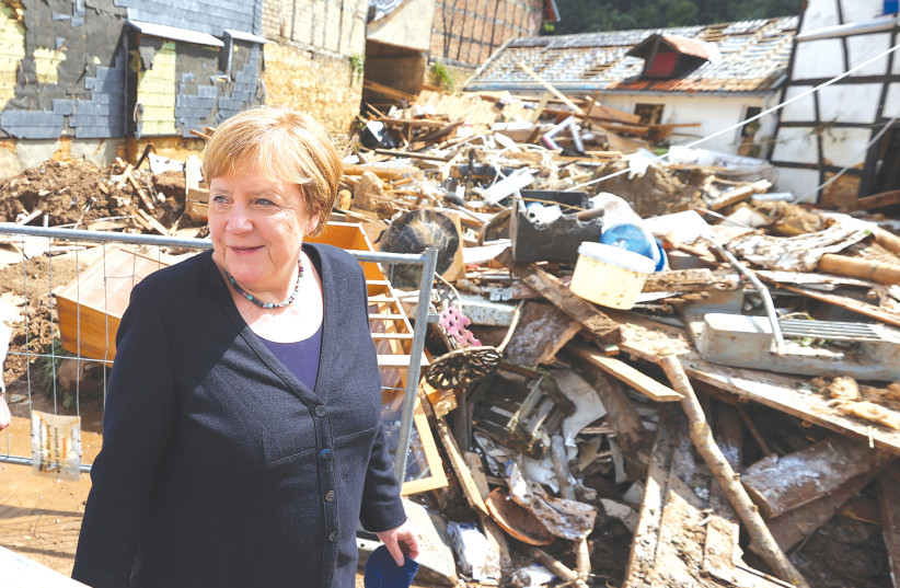 GERMAN CHANCELLOR Angela Merkel visits an area affected by floods caused by heavy rainfalls in Iversheim, a suburb of Bad Muenstereifel, North-Rhine Westphalian state, Germany, yesterday.  (credit: REUTERS)
