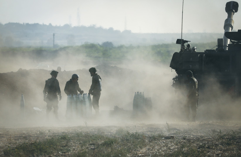 IDF ARTILLERY CORPS members fire retaliatory strikes into Gaza in May. (photo credit: OLIVER FITOUSSI/FLASH90)