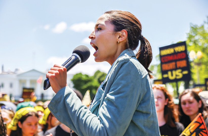 REP. ALEXANDRIA Ocasio-Cortez speaks during a ‘No Climate, No Deal’ demonstration outside the White House last month. (photo credit: EVELYN HOCKSTEIN/REUTERS)