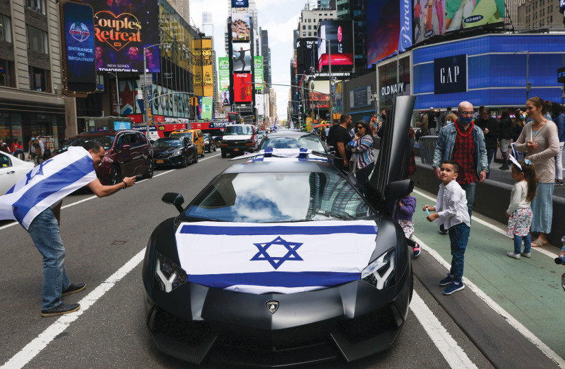 NEW YORKERS participate in a parade to celebrate Israel’s Independence Day, in Times Square in April. (photo credit: CAITLIN OCHS/REUTERS)