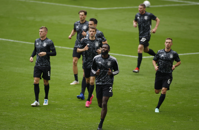 Soccer Football - Euro 2020 - Round of 16 - England v Germany - Wembley Stadium, London, Britain - June 29, 2021 Germany's Toni Kroos, Thomas Mueller, Antonio Rudiger and Joshua Kimmich during the warm up before the match. (credit: JOHN SIBLEY/REUTERS)