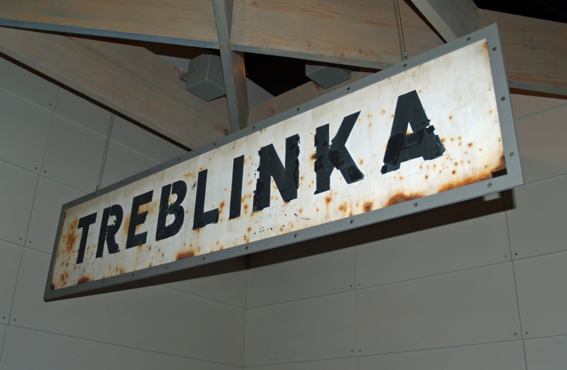 Treblinka German death camp in Poland railway sign at Yad Vashem. (credit: Wikimedia Commons)