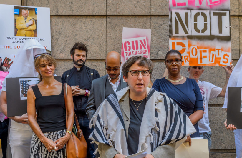 Rabbi Sharon Kleinbaum of Congregation Beth Simchat Torah joined others at a 2016 press conference condemning the appearance of Smith & Wesson's CEO at a conference (photo credit: ERIK MCGREGOR/LIGHTROCKET VIA GETTY IMAGES/JTA)